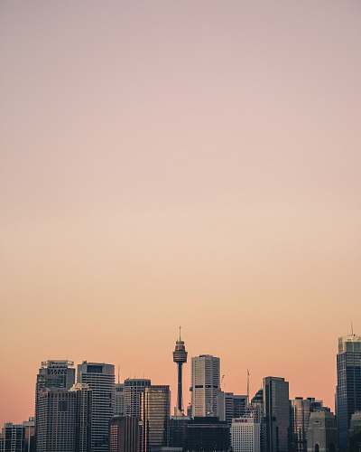 urban high rise building under orange skies skyscraper