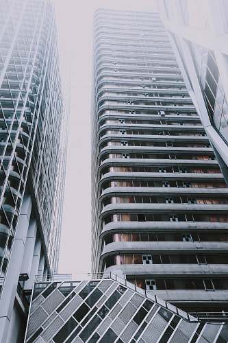 building high-top gray concrete buildings during daytime high rise
