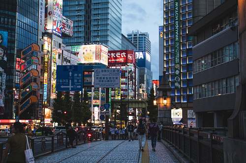 town people standing between high buildings urban