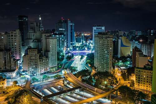 urban time lapse photography of a city highway building