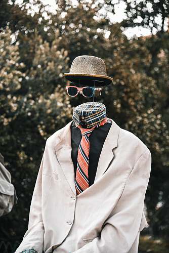 apparel necktie, hat, and sunglasses hat