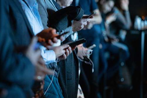 apparel people using phone while standing person