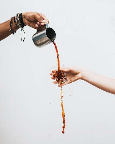 drink person pouring liquid on drinking glass food