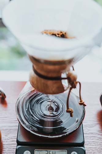 brown selective focus photography of coffee funnel drink