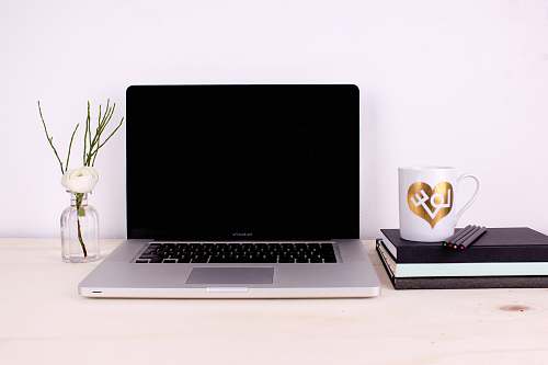 laptop gray and black laptop computer cup
