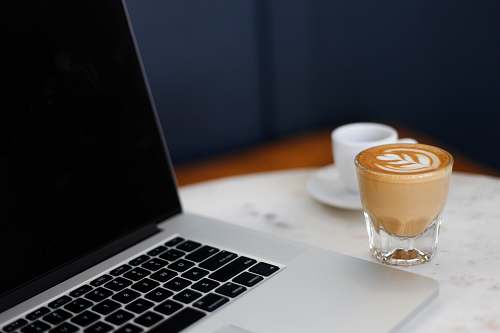 laptop turned-off MacBook Pro cup