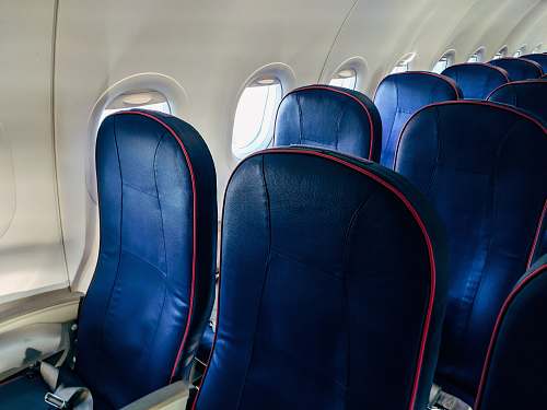 headrest blue airplane seat lot pillow