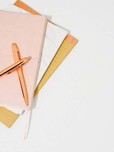office ballpoint pens on pink notebook blog