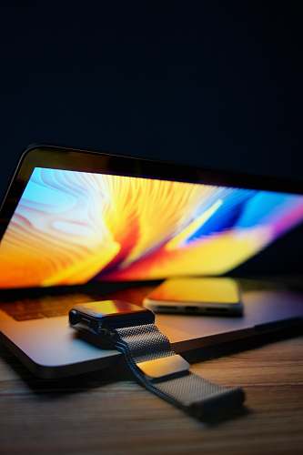 electronics Apple Watch and MacBook Pro monitor