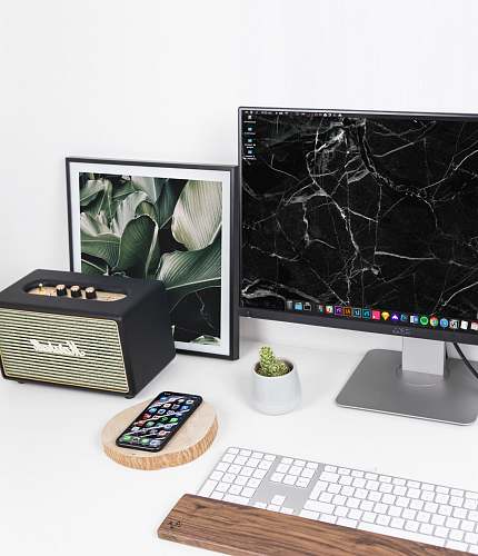 computer black Dell flat screen computer monitor besides black photo frame hardware