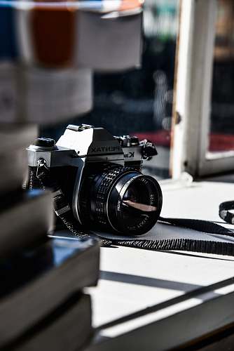 camera black Pentax camera on opened window black