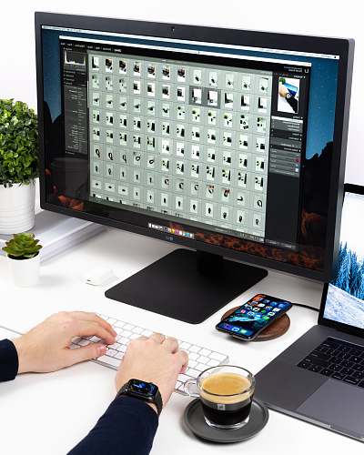 computer person using Apple magic keyboard pc
