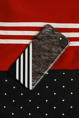 symbol black iPhone on red and white textile tie