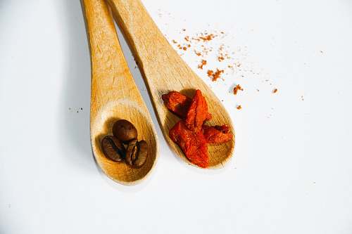 bean coffee beans on brown wooden spoon flora