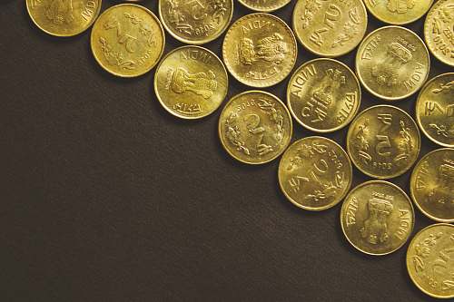 financing round gold-colored coins coin