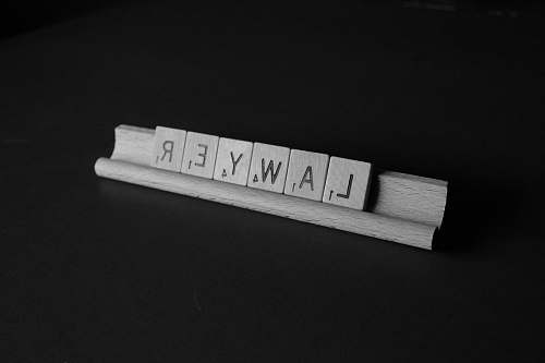 black-and-white brown wooden scrable law