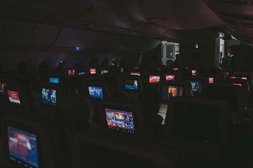 person airplane seat with flat screen TV rack arcade game machine