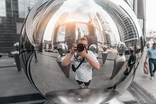 person man holding DSLR camera moscow city