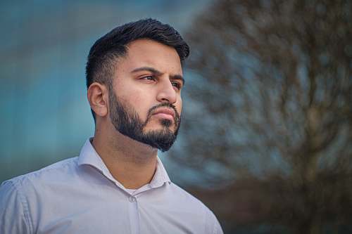 face man in white collared top person