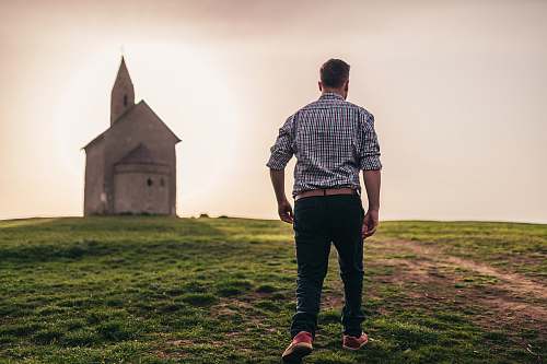 people man walking in green grass person