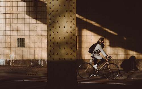 people person biking under highway bicycle
