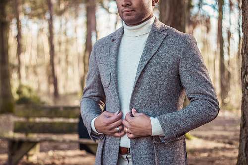 person person holding gray coat people