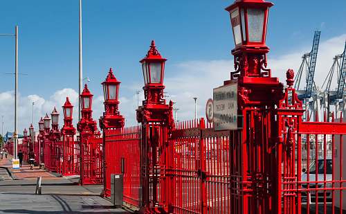 person shallow focus photo of lamp posts architecture