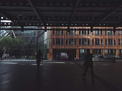 person silhouette photo of woman and man walking pedestrian