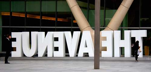person The Avenue sign architecture