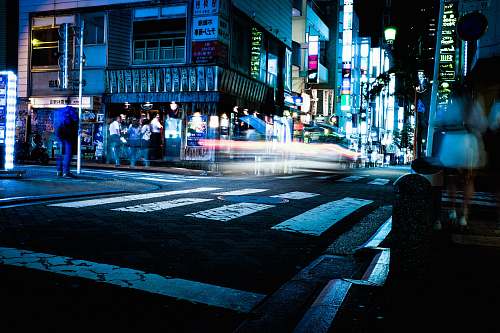 night time lapse photography of cars person