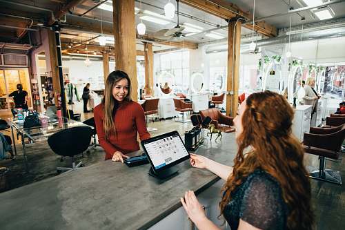 person two women near tables furniture