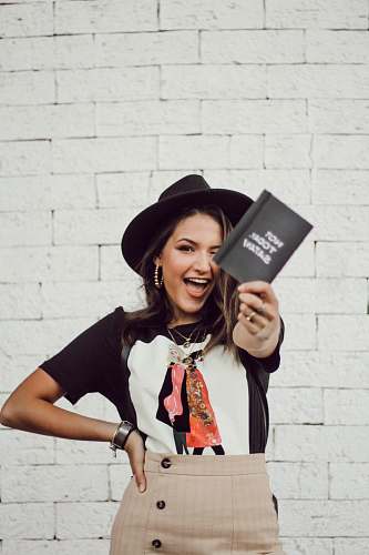 person woman in a black brimmed hat hat