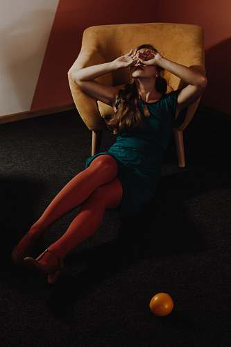 person woman leaning on armchair people