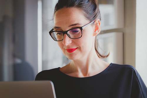 person woman wearing black shirt glasses