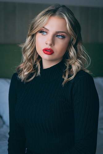 apparel woman wearing black sweater clothing