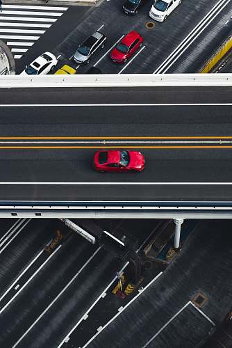 road red car on super highway aerial photography intersection
