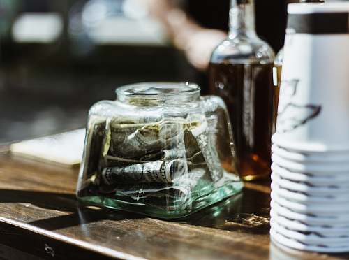 bottle US dollar banknote in jar plant