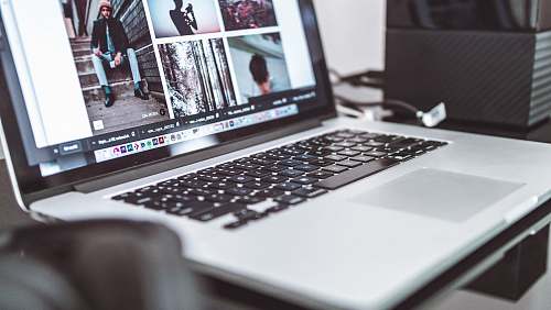 computer silver laptop displaying man sitting on stairs pc