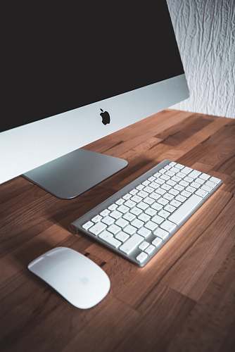 wood turned-off silver iMac computer hardware