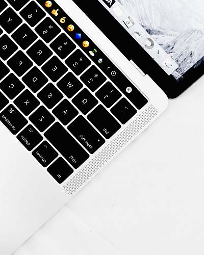 black closeup photo of white and black laptop computer keyboard
