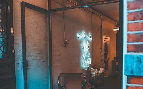 clinic white neon signage with lights on inside room light