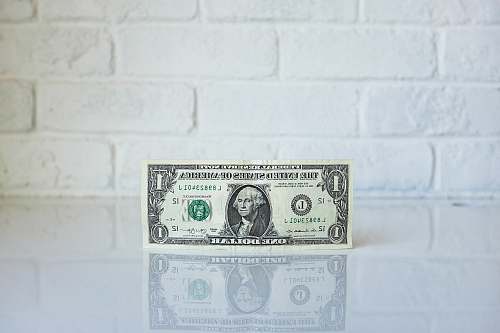 equity 1 U.S. dollar banknote on white surface dollar