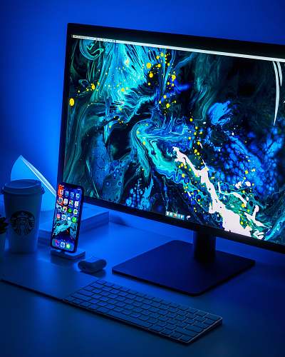 screen flat screen computer monitor turned on beside black keyboard display