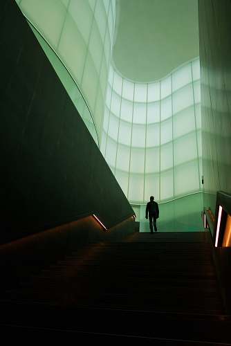 milano man walking on stair inside building italy