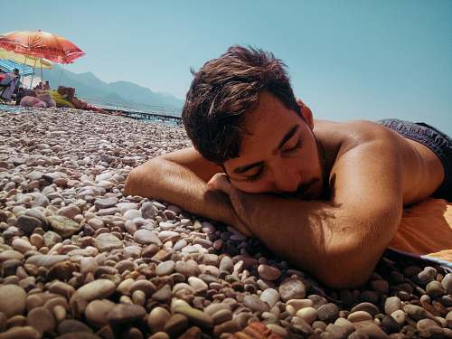 person unknown person lying outdoors human
