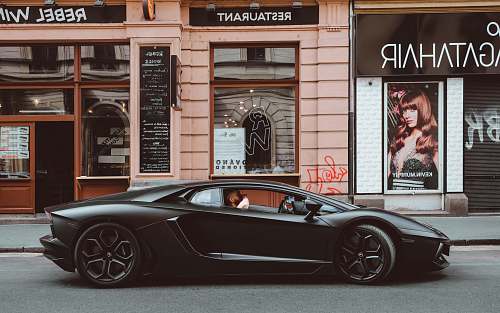 human black Lamborghini on the street person