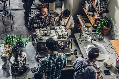 person man buying coffee on counter plant