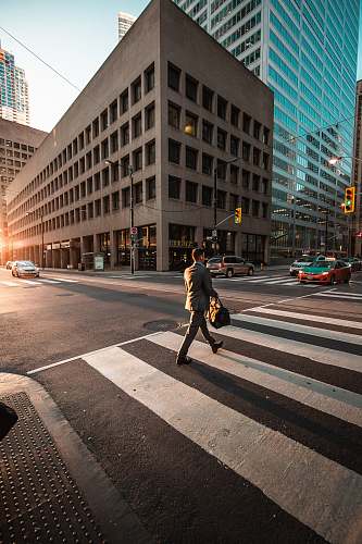 human man crossing pedestrian lane person