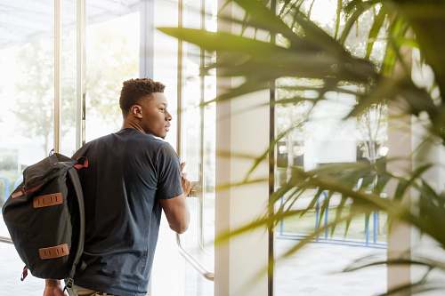 person man holding glass door human