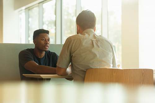 human two men talking person